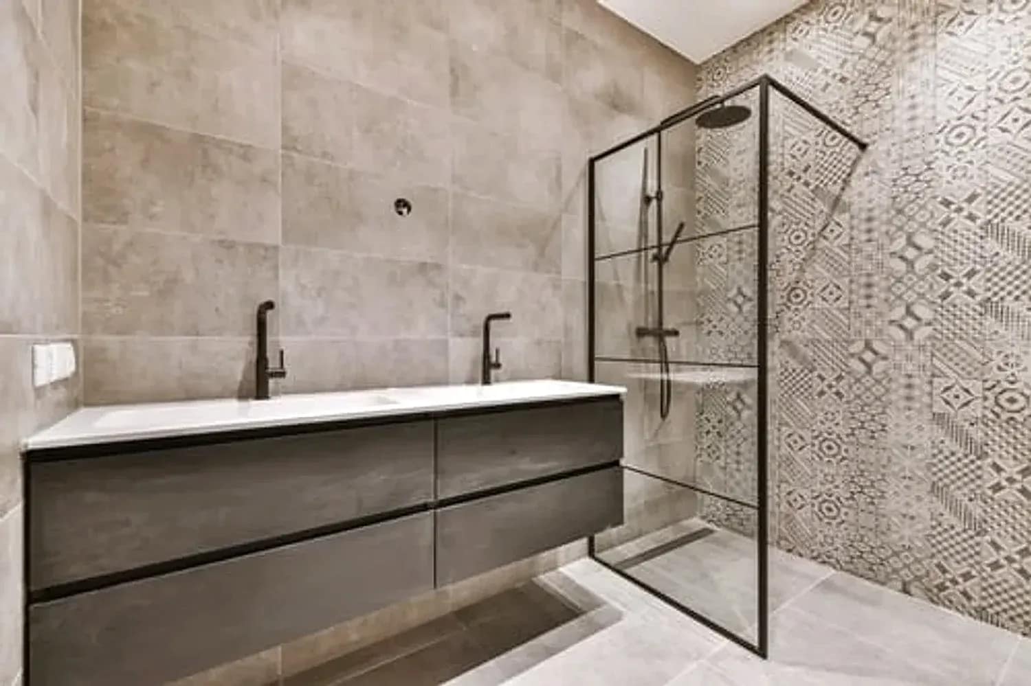 Modern remodeled bathroom with a walk-in glass shower, floating vanity and large-format tile in Washington DC