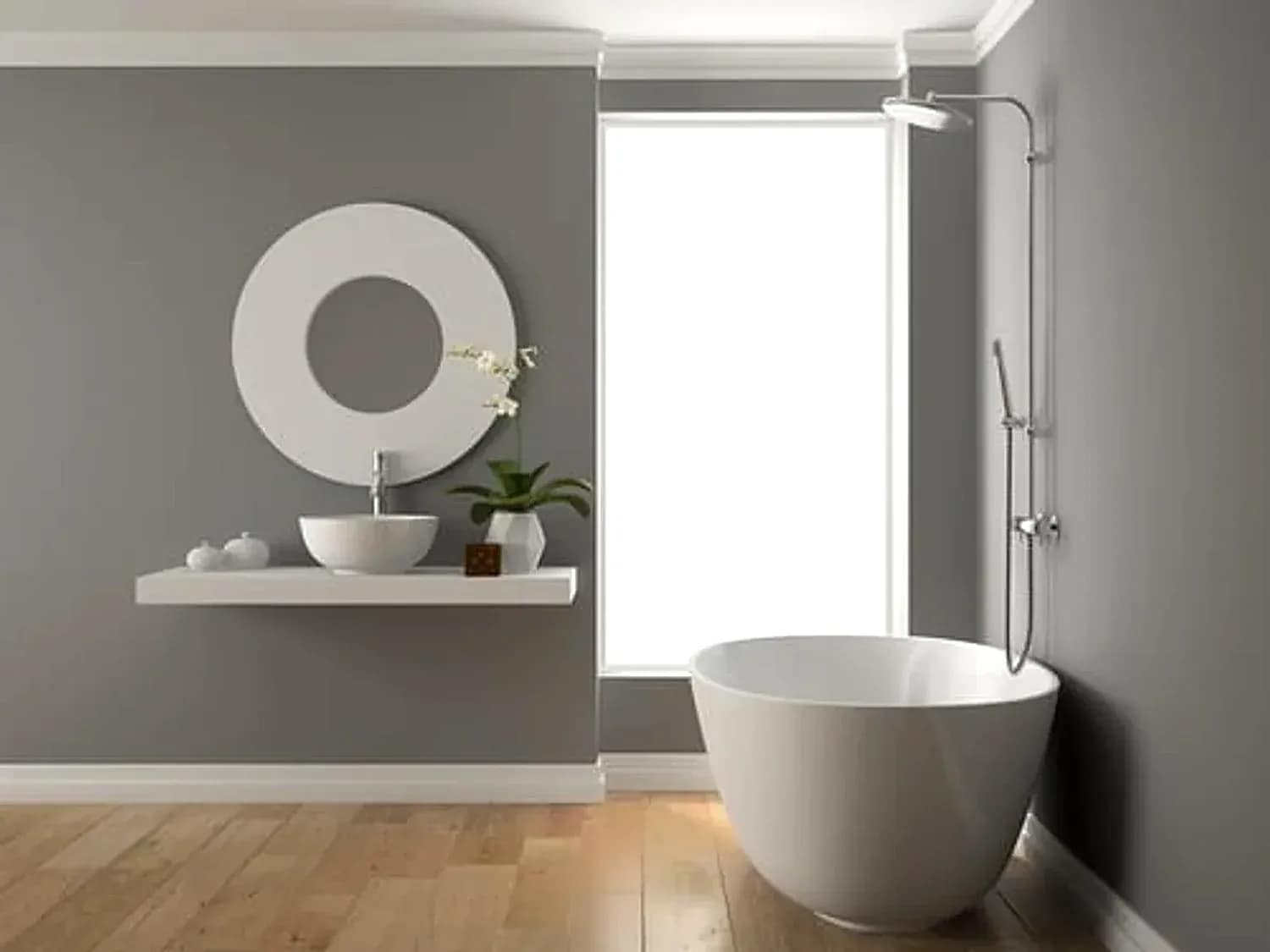 Compact remodeled bathroom with a floating shelf vanity, round mirror and glass shower enclosure